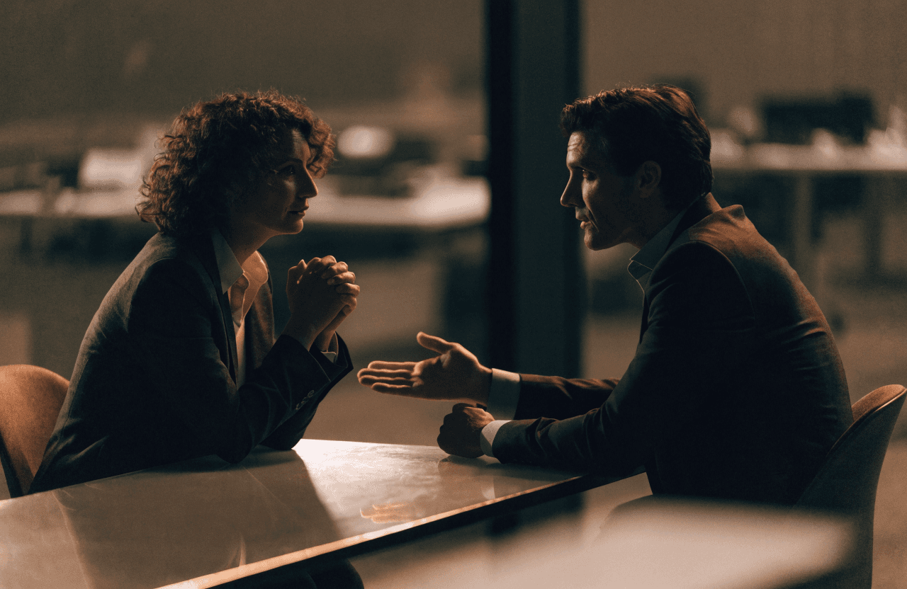 Two professionals in a focused one-on-one coaching conversation
